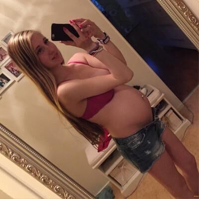 Pregnant Bitch Shows Her Belly and Sexy Red Bra