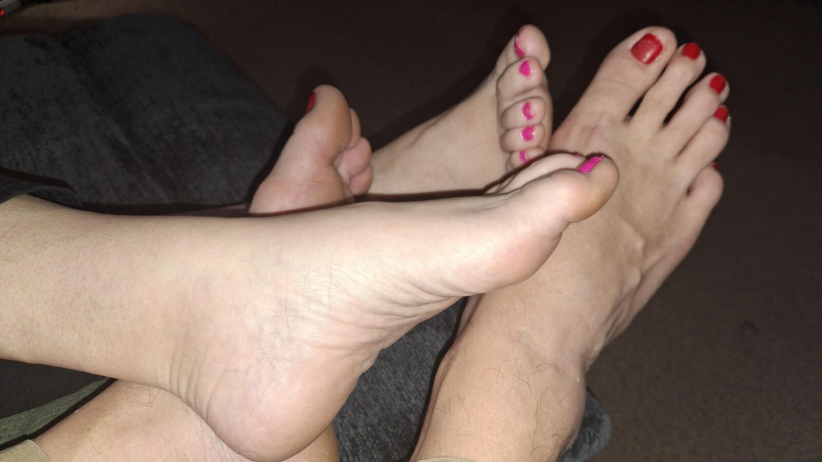 Red toe footsie showing off our feet and toes