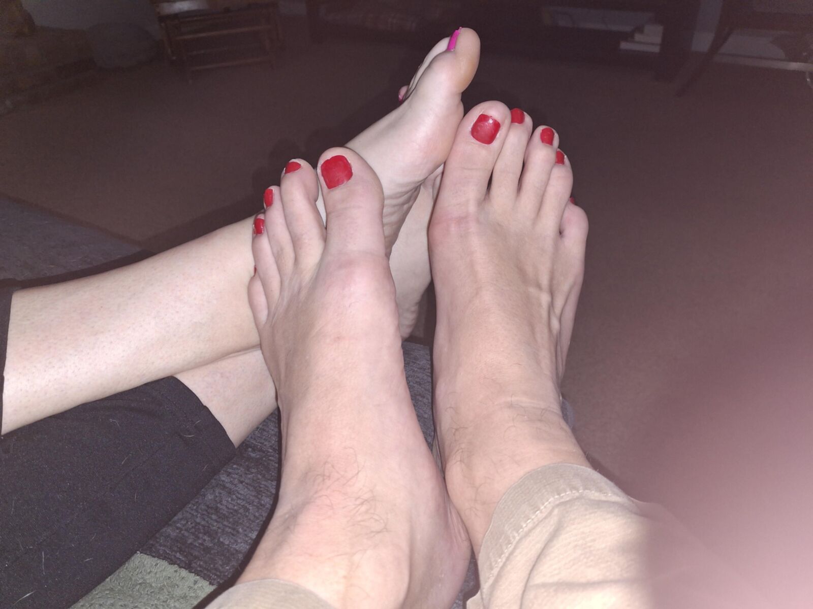 Red toe footsie showing off our feet and toes