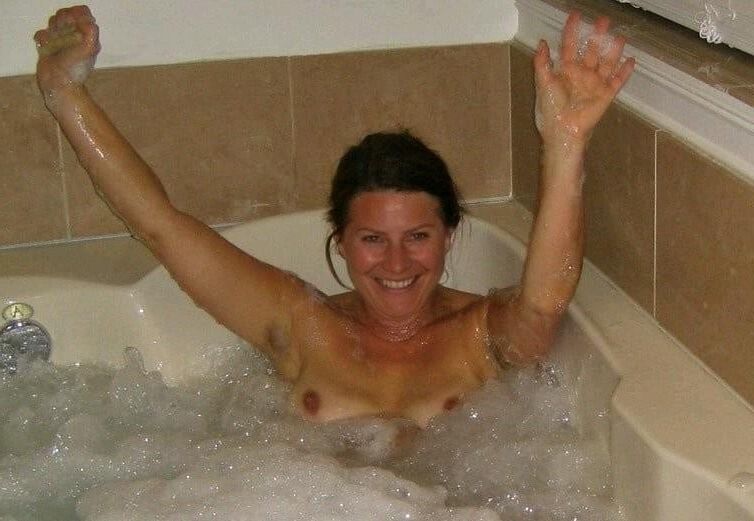 Women in Bath Bubbles and Suds On Her Boobs 