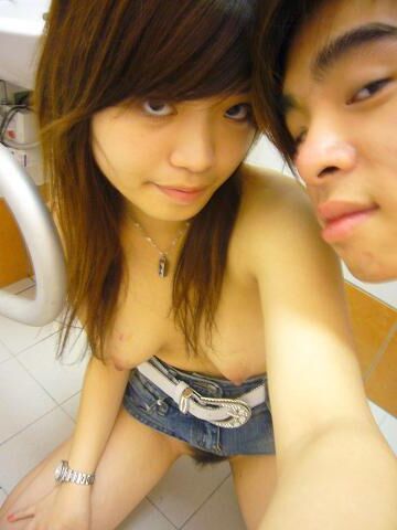 YOUNG ASIAN COUPLE SELFIES IN THE BATHROOM