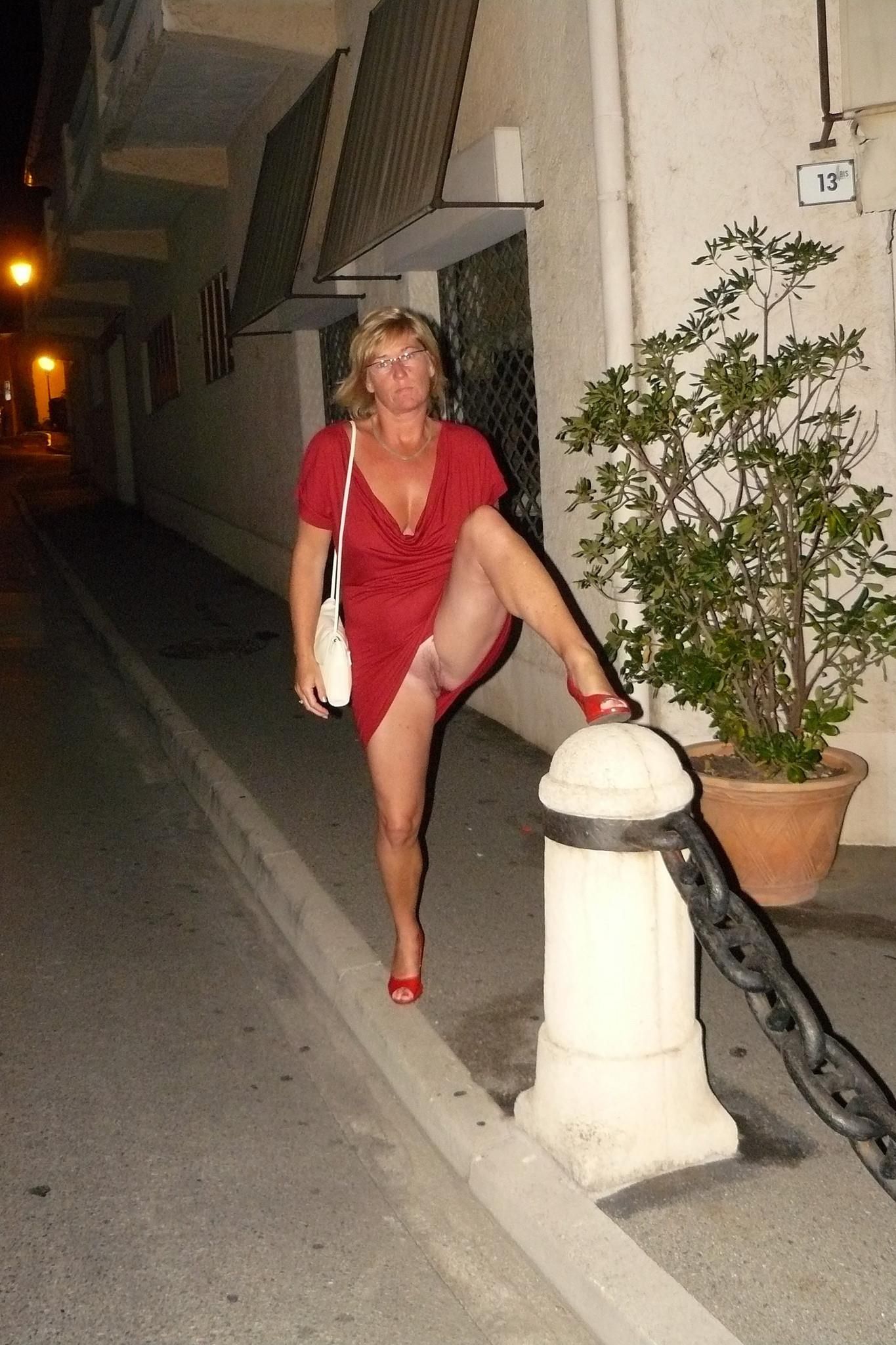 Women Standing Naked Commando By a Plant