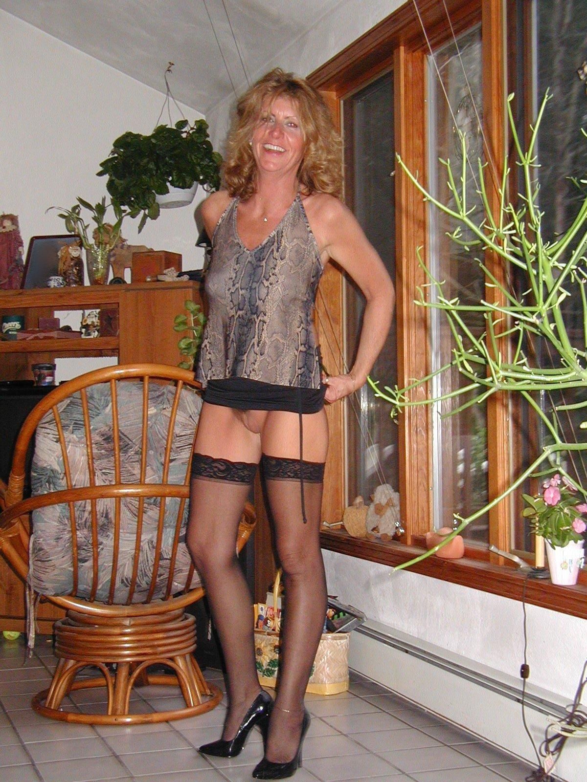Women Standing Naked Commando By a Plant