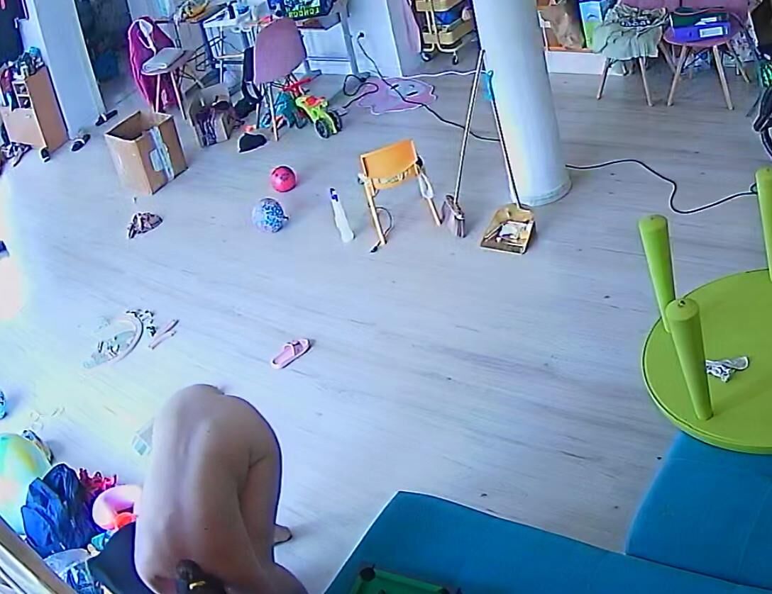 A wife from Bucharest cleans the house