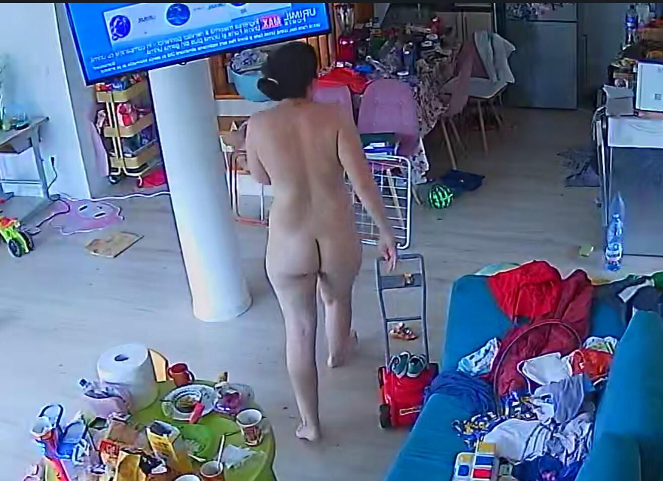 A wife from Bucharest cleans the house