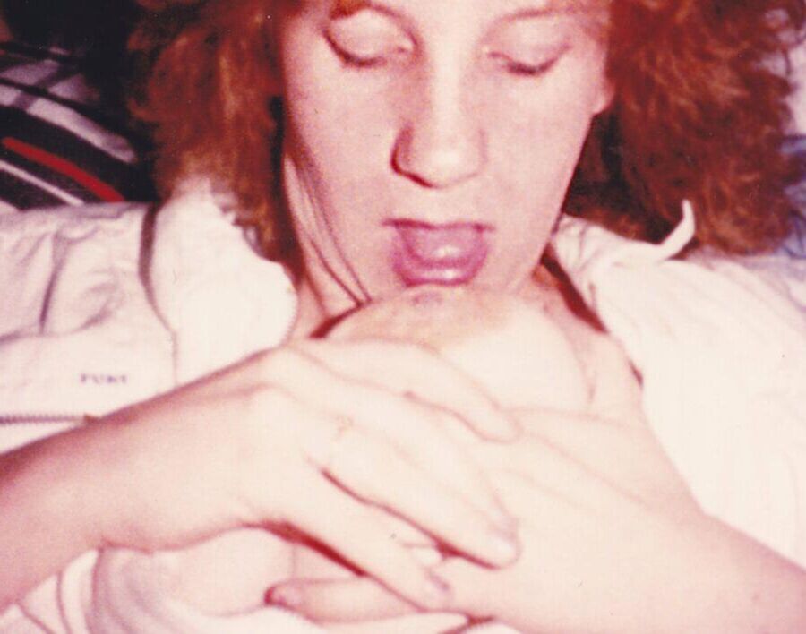 sucking her own tit